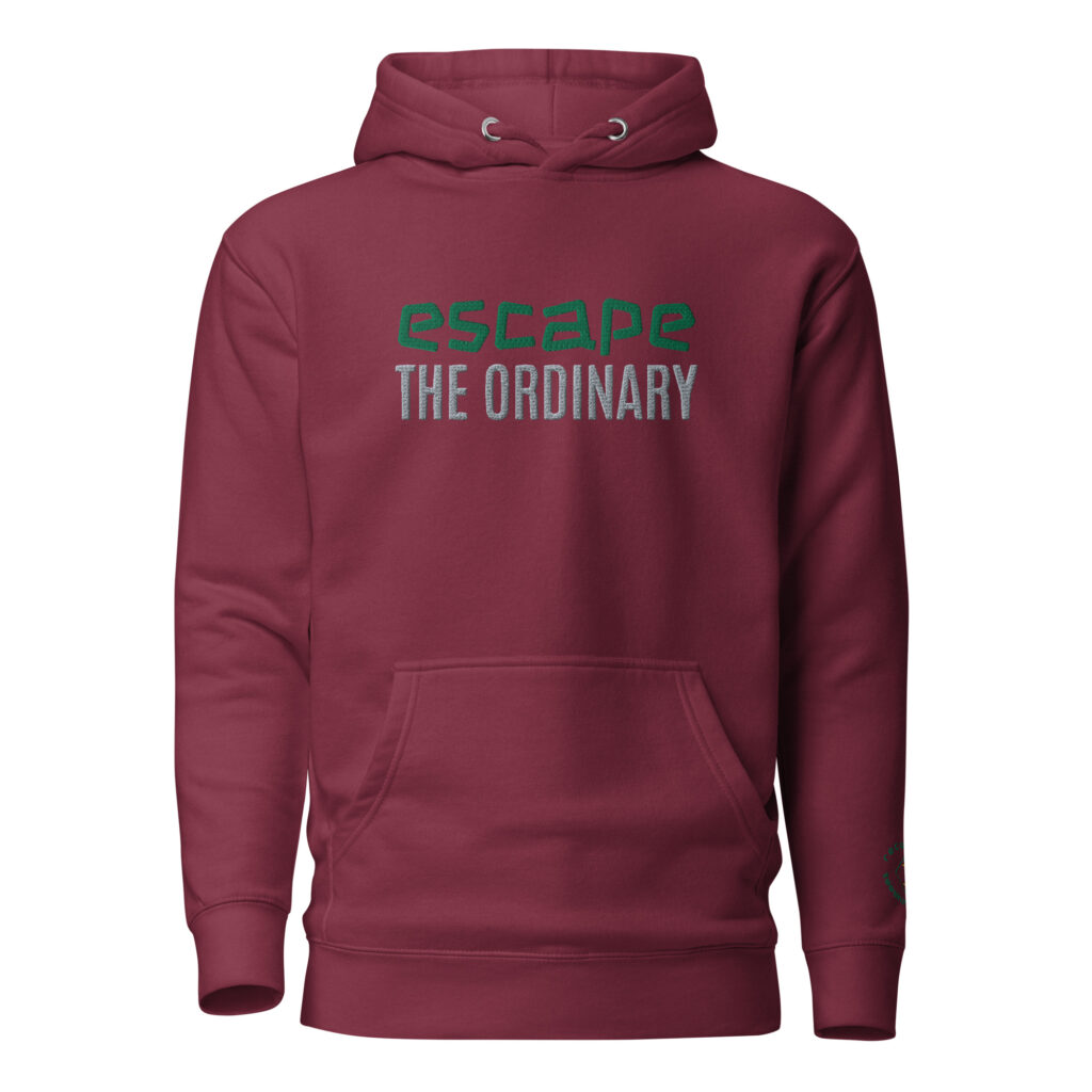 Image of our most popular hoodie with the text 'escape the ordinary' embroidered on the front of the hoodie